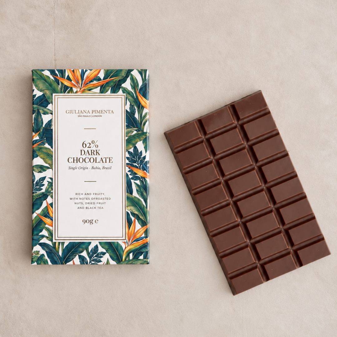 Single origin 62% dark chocolate bar unwrapped beside its pack, 90g, handmade in London