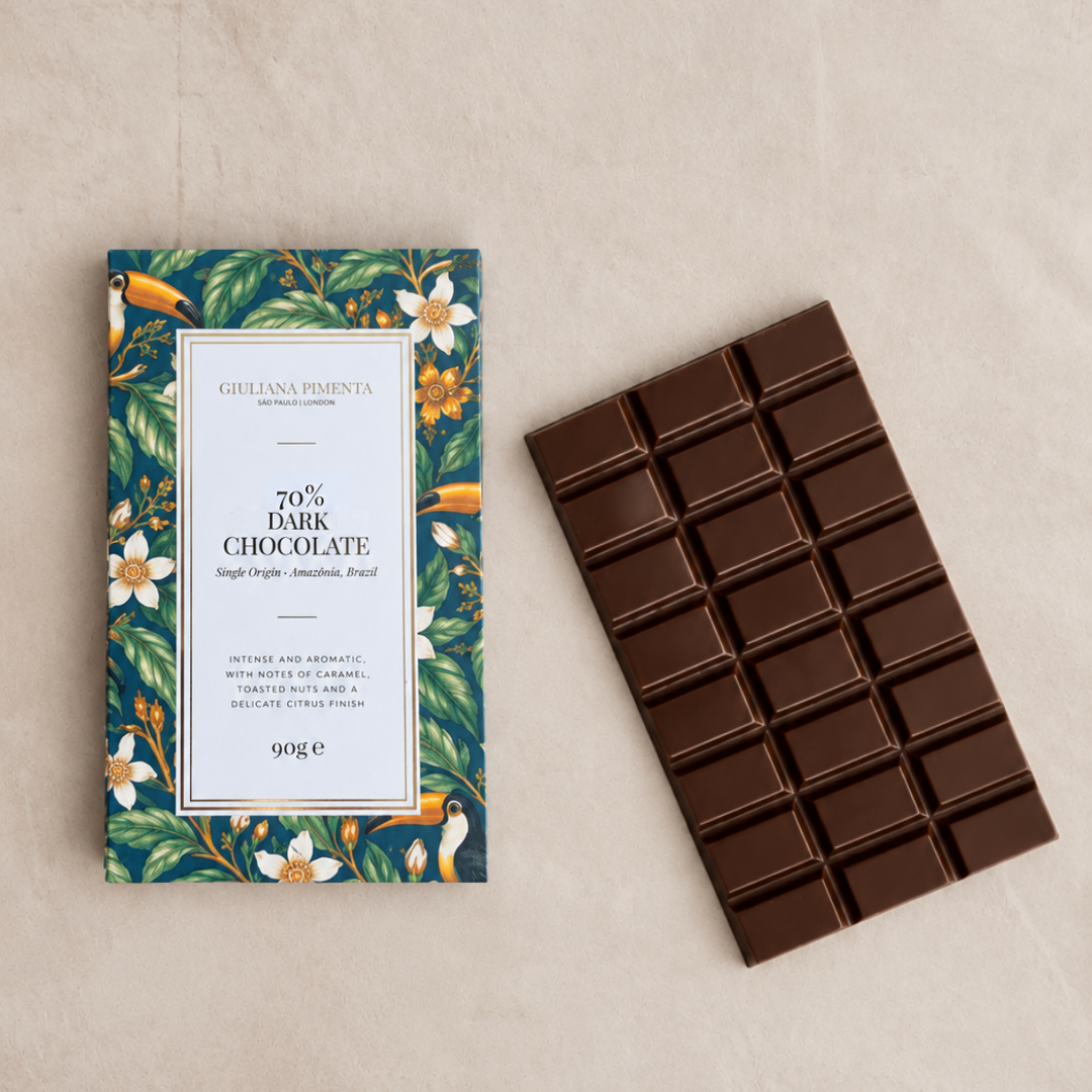 Single origin 70% dark chocolate bar unwrapped beside its pack, 90g, micro lot