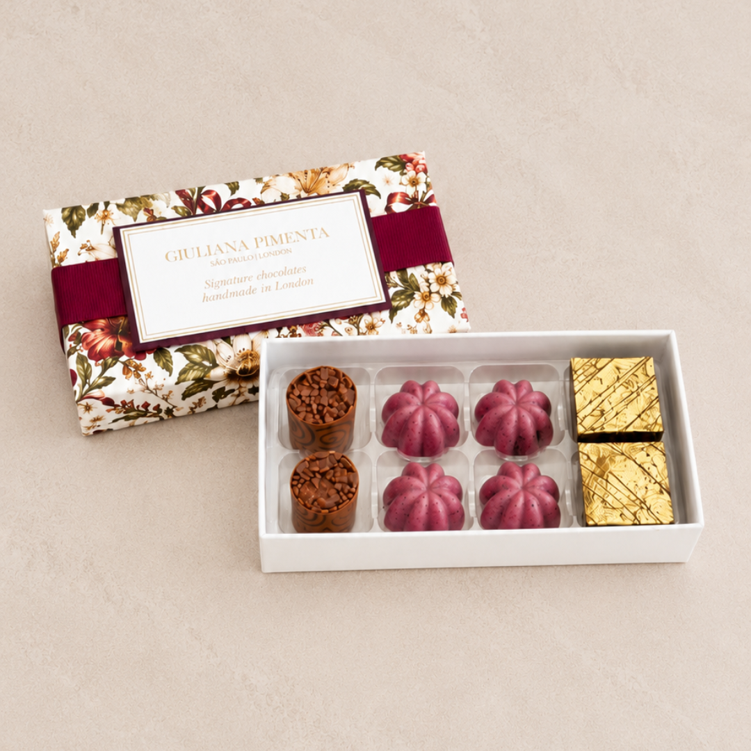Best sellers chocolate box, eight bonbons beside a burgundy Festive Garden gift box