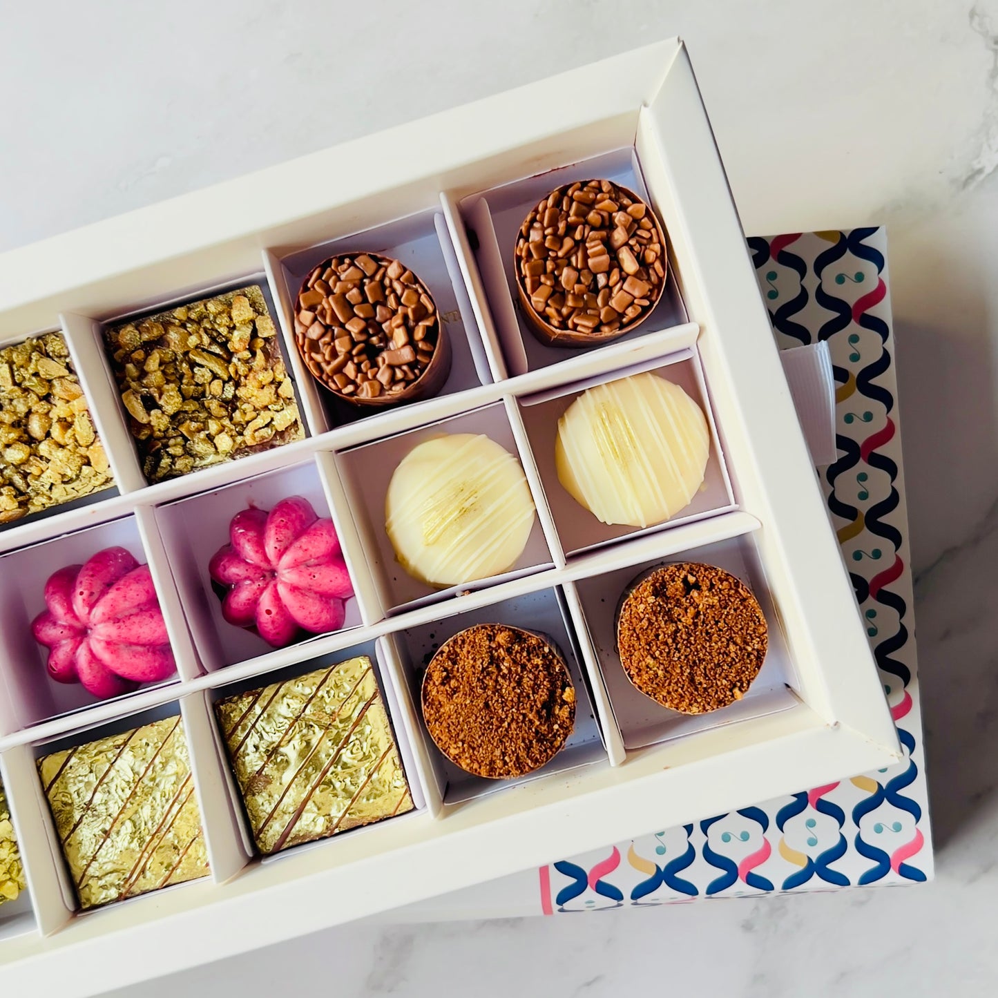 
                  
                    Luxury artisan chocolate gift box with 18 handcrafted chocolates by Giuliana Pimenta Chocolates
Handcrafted chocolate selection box, curated monthly by Giuliana Pimenta Chocolates atelier
Premium surprise chocolate box UK — The Discovery Box by Giuliana Pimenta Chocolates
                  
                