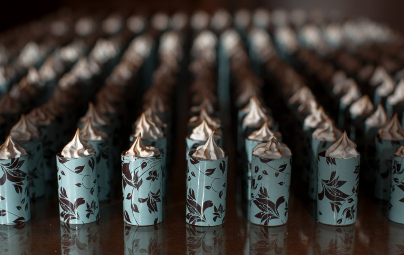 a wooden table full with Giuliana Pimenta's Signature Collection Lime Pie in light blue pattern lined side by side