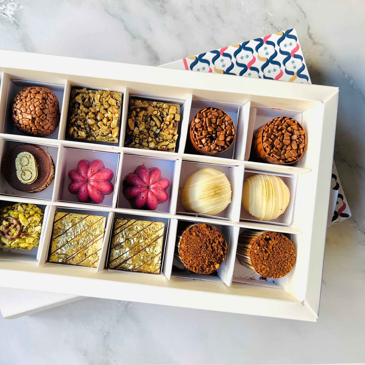 
                  
                    Luxury artisan chocolate gift box with 18 handcrafted chocolates by Giuliana Pimenta Chocolates
Handcrafted chocolate selection box, curated monthly by Giuliana Pimenta Chocolates atelier
Premium surprise chocolate box UK — The Discovery Box by Giuliana Pimenta Chocolates
                  
                